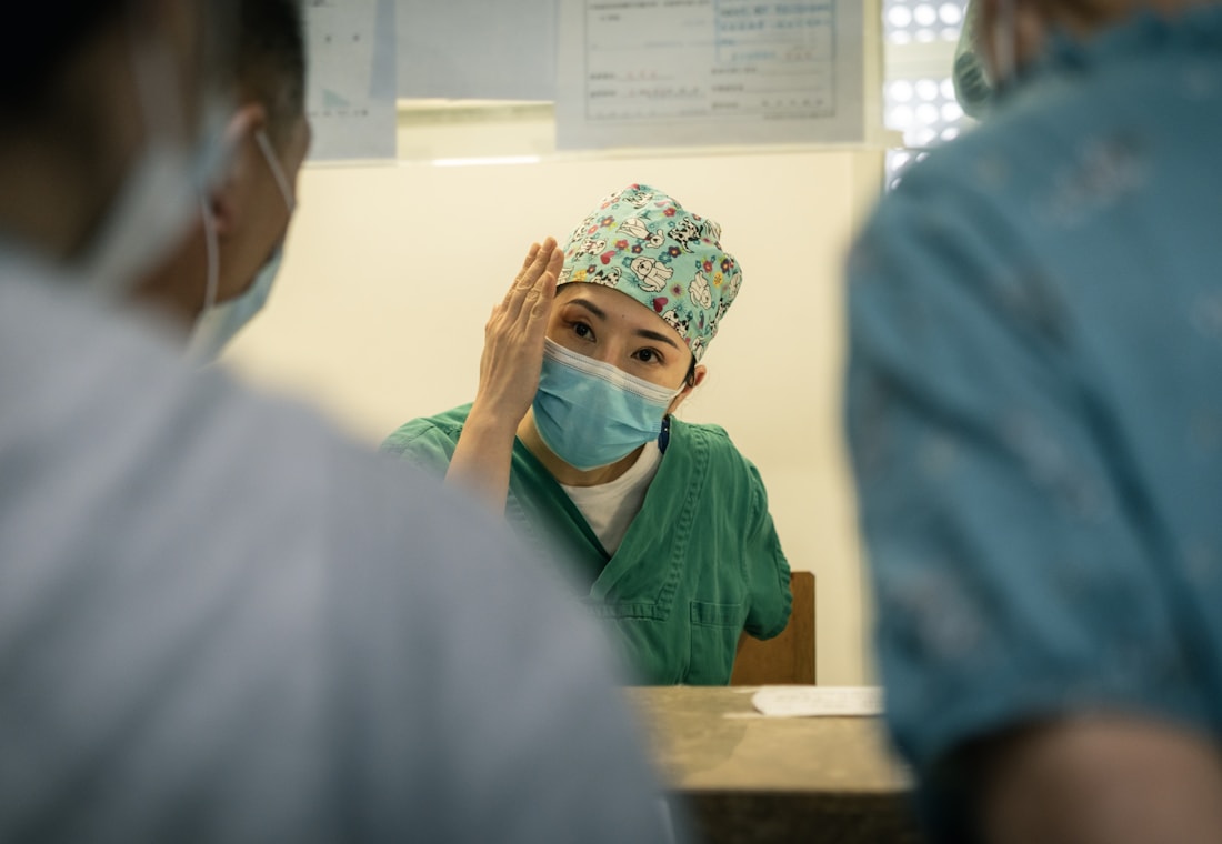Chinese clinician discussing care planning with a medical team