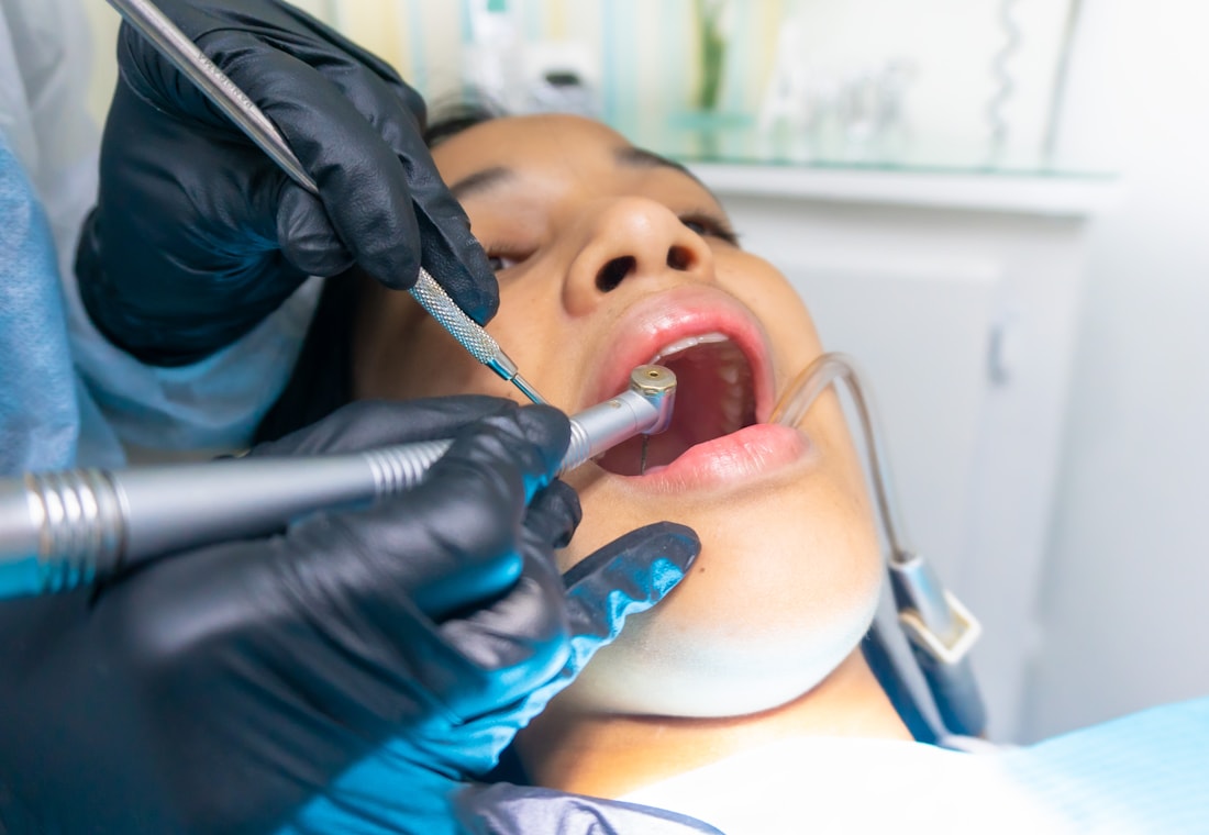 Dental care treatment with an East Asian patient in a clinic